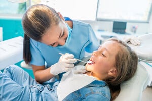 A young child at the dentist.