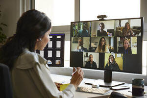 Diverse team using digital technology for a video call