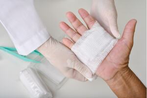 Doctor dressing a wound